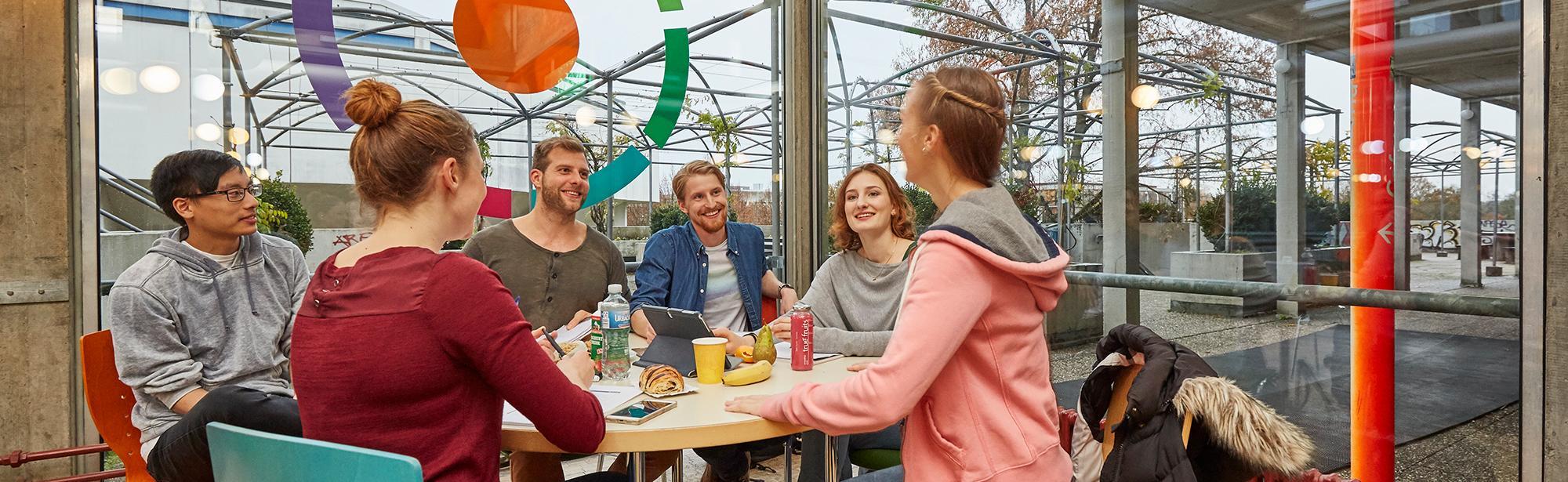 Studens sitting around a table