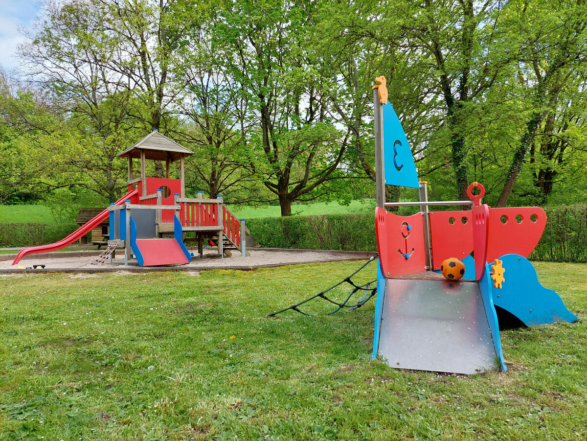 Playground at the Löwenzahn day-care centre with slide and pirate ship