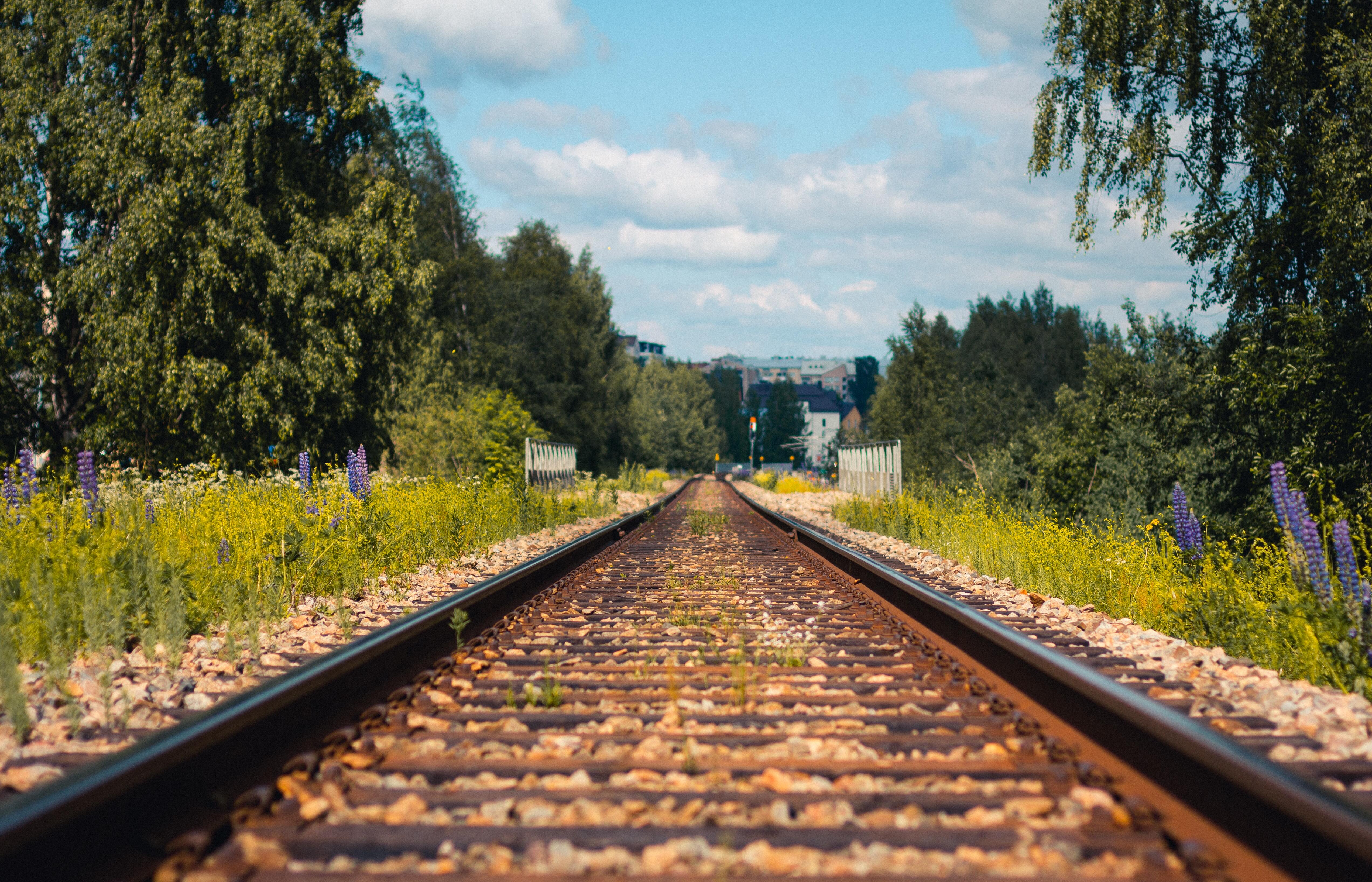 train tracks against a blue sky